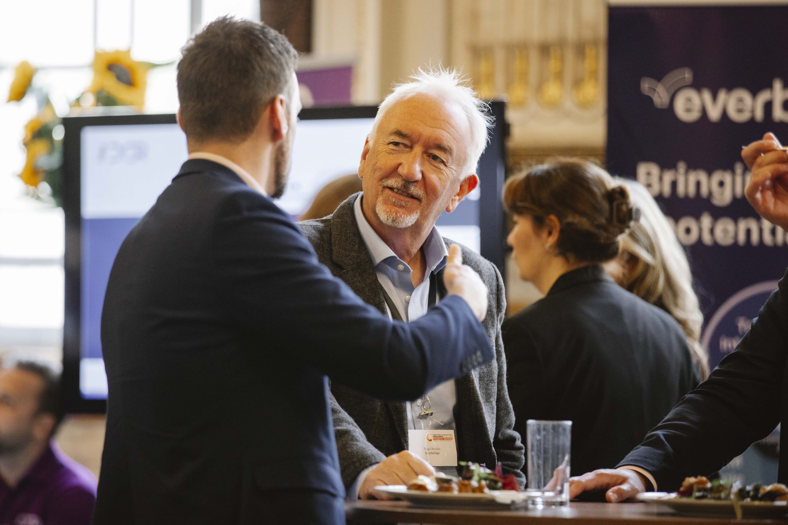 Conference attendees in conversation